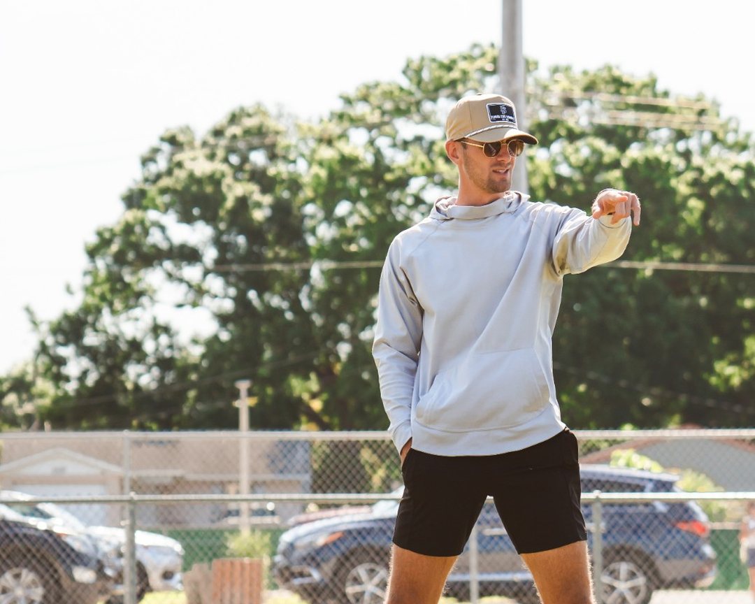 Sage Hansard coaching on the field