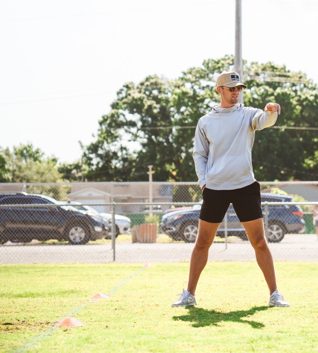 Sage Hansard coaching on the field